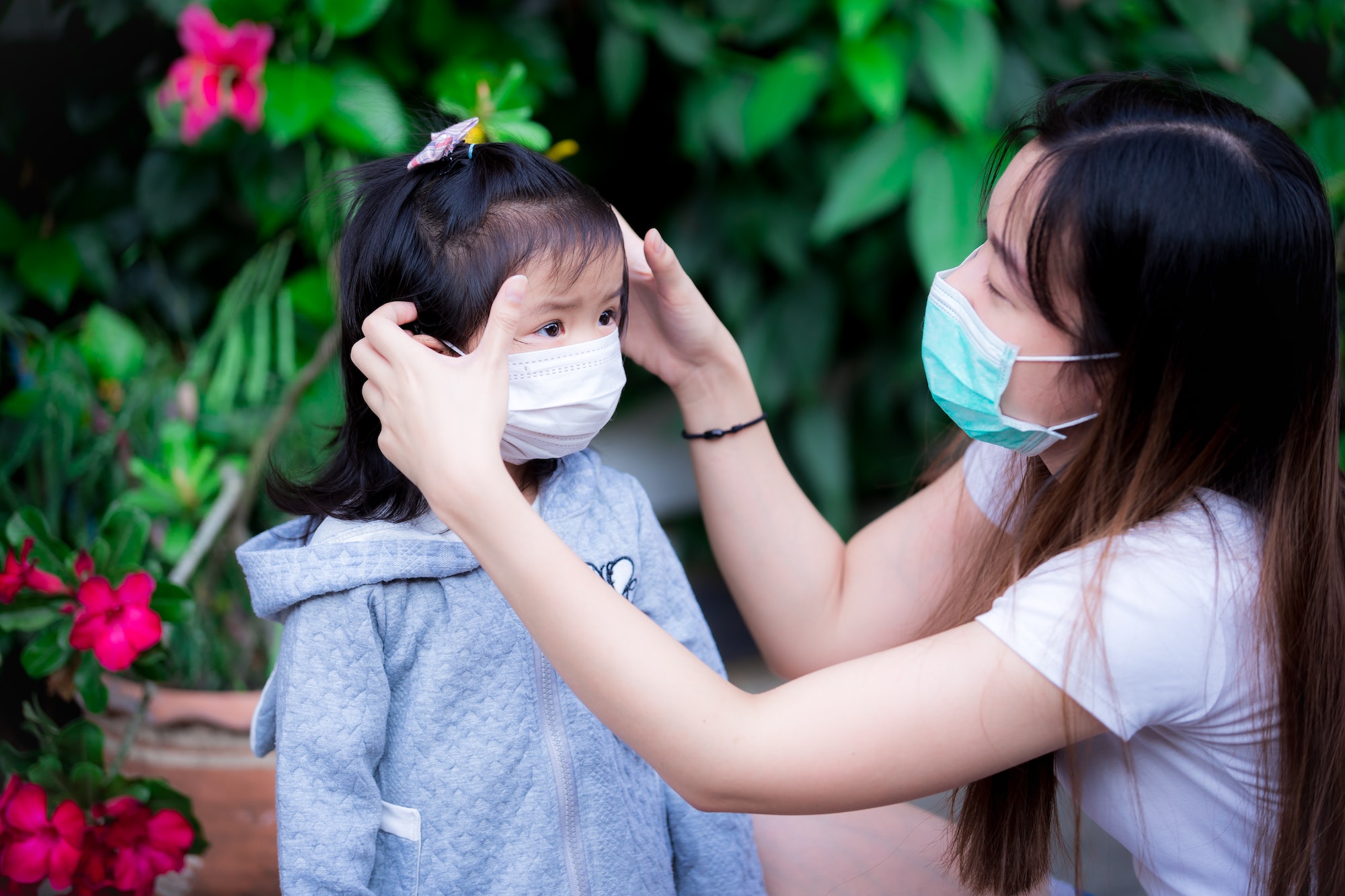 Family wear mask to prevent respiratory infections during corona virus outbreak.
